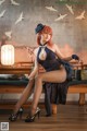 A woman sitting on top of a wooden bench.